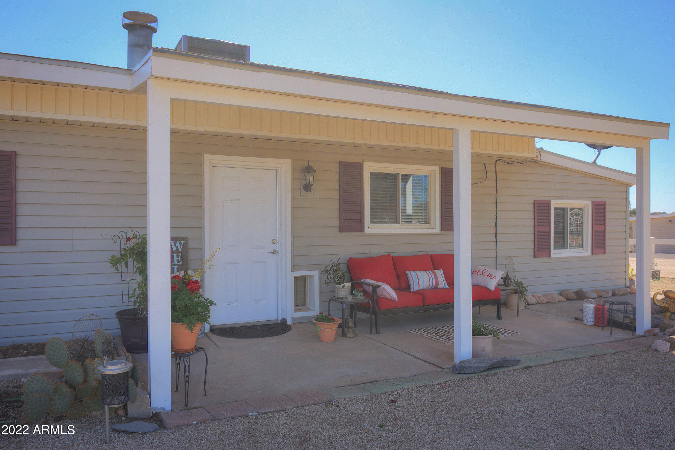 35225 North 3rd Street Phoenix, AZ 85086 - Photo 28 of 40 a view of a house with a backyard and a chair