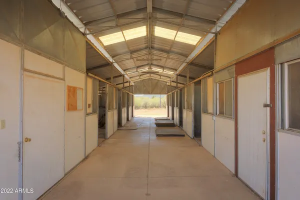 a view of hallway with furniture