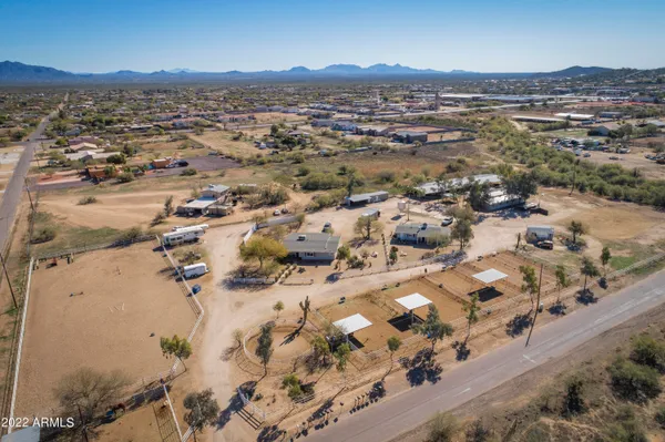 an aerial view of residential houses with outdoor space