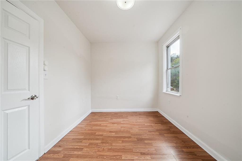 2819 Spring Garden Avenue Pittsburgh, PA 15212 - Photo 11 of 25 wooden floor in an empty room with a window