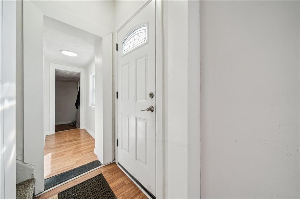 2819 Spring Garden Avenue Pittsburgh, PA 15212 - Photo 17 of 25 a view of a hallway with wooden floor and closet