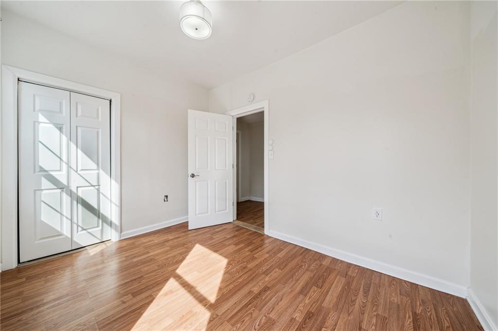 2819 Spring Garden Avenue Pittsburgh, PA 15212 - Photo 18 of 25 a view of a room with wooden floor and doors