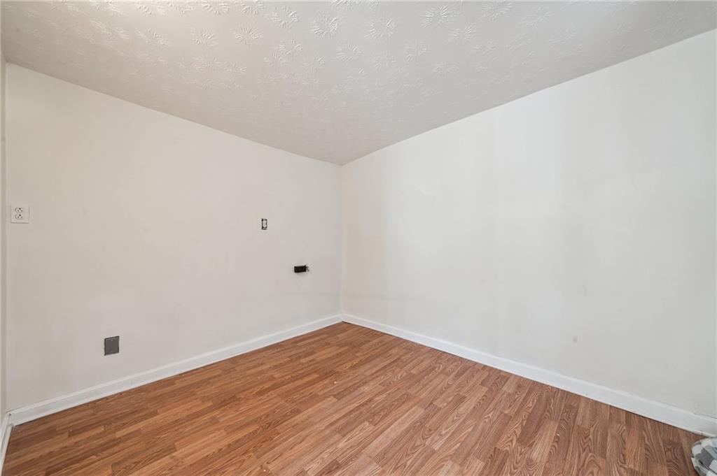 2819 Spring Garden Avenue Pittsburgh, PA 15212 - Photo 20 of 25 a view of an empty room with wooden floor