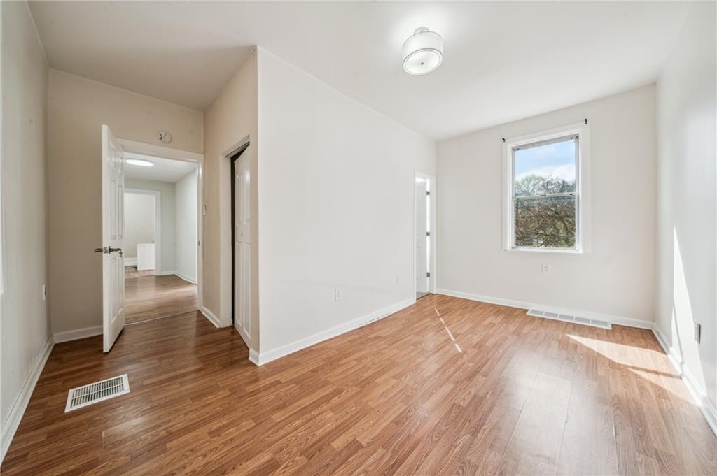 2819 Spring Garden Avenue Pittsburgh, PA 15212 - Photo 22 of 25 a view of a room with wooden floor and a bathroom