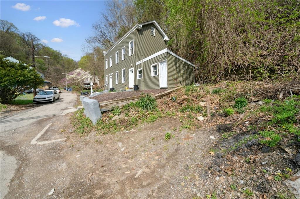 2819 Spring Garden Avenue Pittsburgh, PA 15212 - Photo 4 of 25 a front view of a house with garden