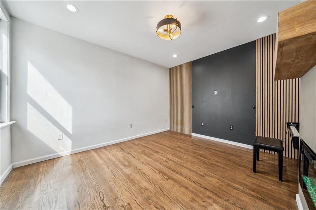 2819 Spring Garden Avenue Pittsburgh, PA 15212 - Photo 6 of 25 a view of an empty room with wooden floor