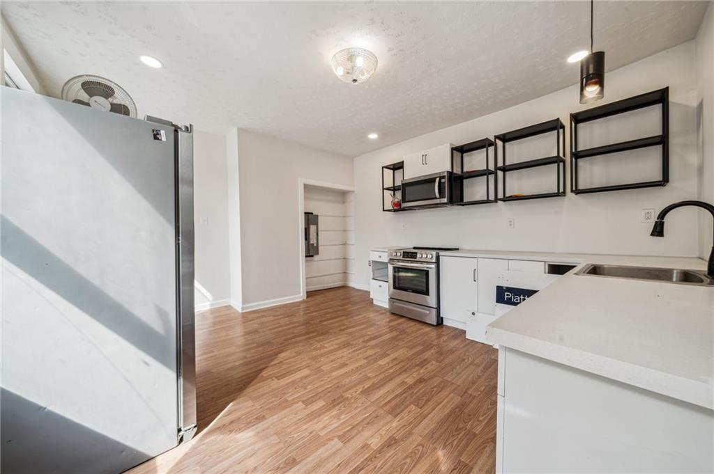 2819 Spring Garden Avenue Pittsburgh, PA 15212 - Photo 9 of 25 a view of a hallway with cabinets