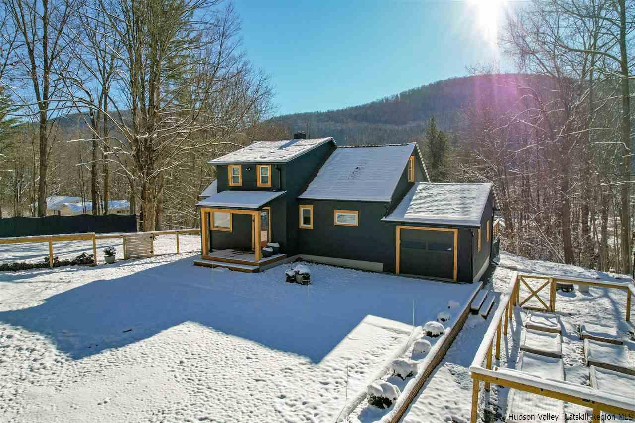 30-32 Rudy Frank Road Shandaken, NY 12480 - Photo 1 of 35 a view of a roof deck with furniture and a fireplace