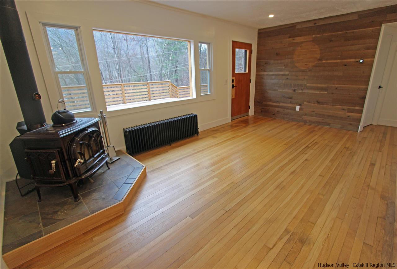 30-32 Rudy Frank Road Shandaken, NY 12480 - Photo 17 of 35 a living room with furniture and a flat screen tv