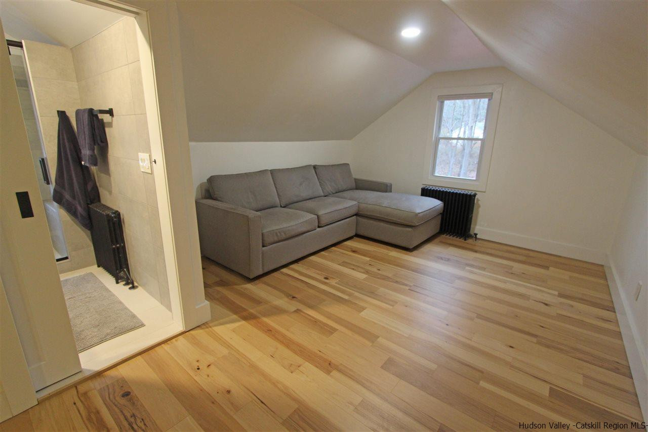 30-32 Rudy Frank Road Shandaken, NY 12480 - Photo 25 of 35 a living room with furniture and a flat screen tv