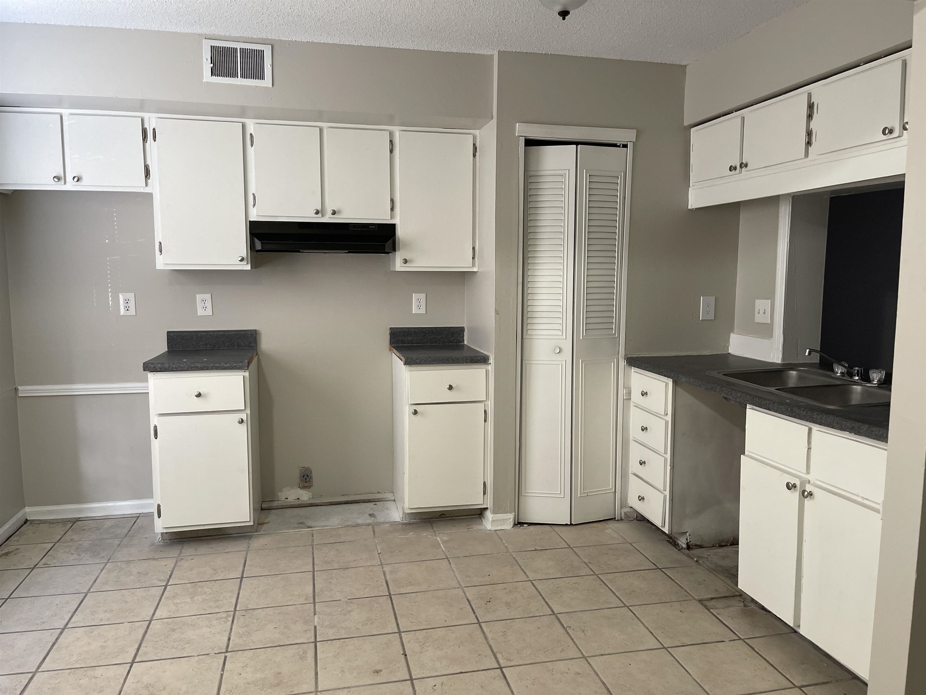 3754 Cambridge Station Drive, Unit 3754 Memphis, TN 38115 - Photo 2 of 9 a kitchen with white cabinets and refrigerator