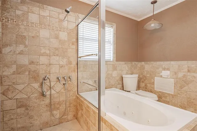 a bathroom with a bathtub and shower