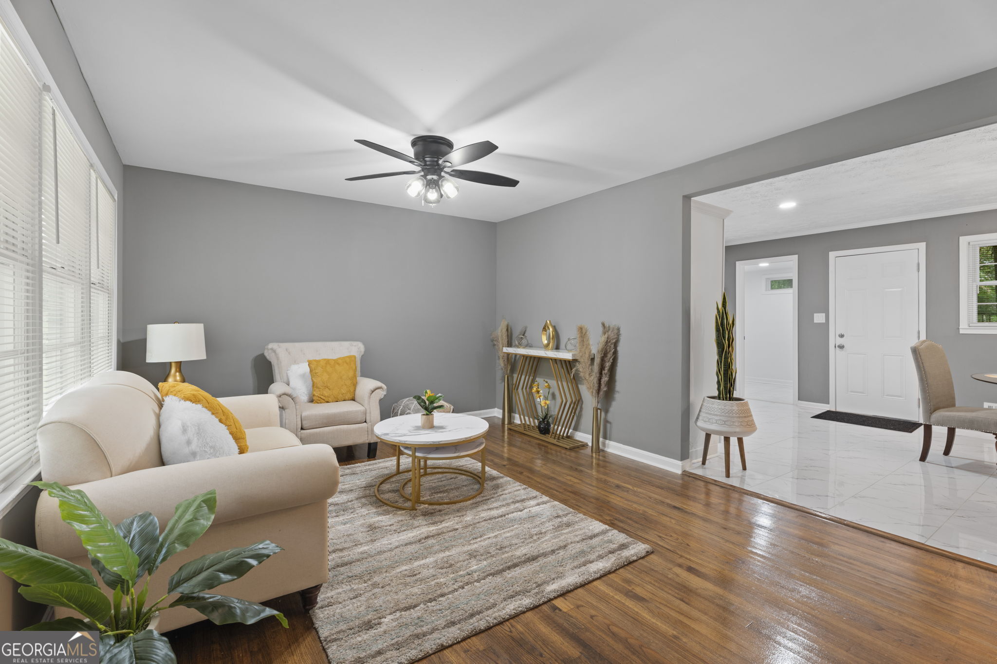 3567 Forrest Park Road Southeast Atlanta, GA 30354 - Photo 6 of 29 a living room with furniture and a chandelier