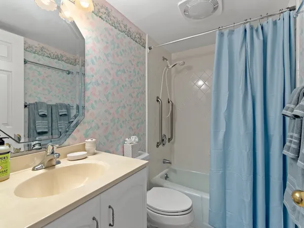 a view of a hallway with washer and dryer