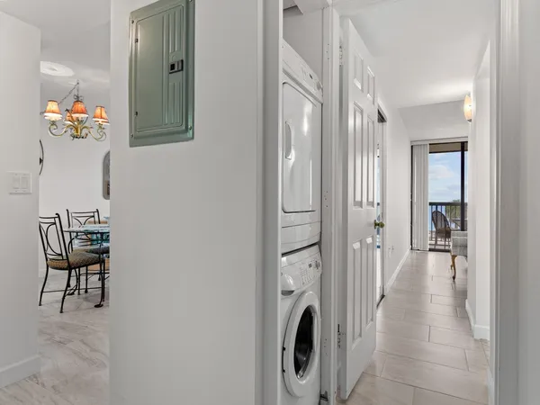 a view of a balcony with chair and table