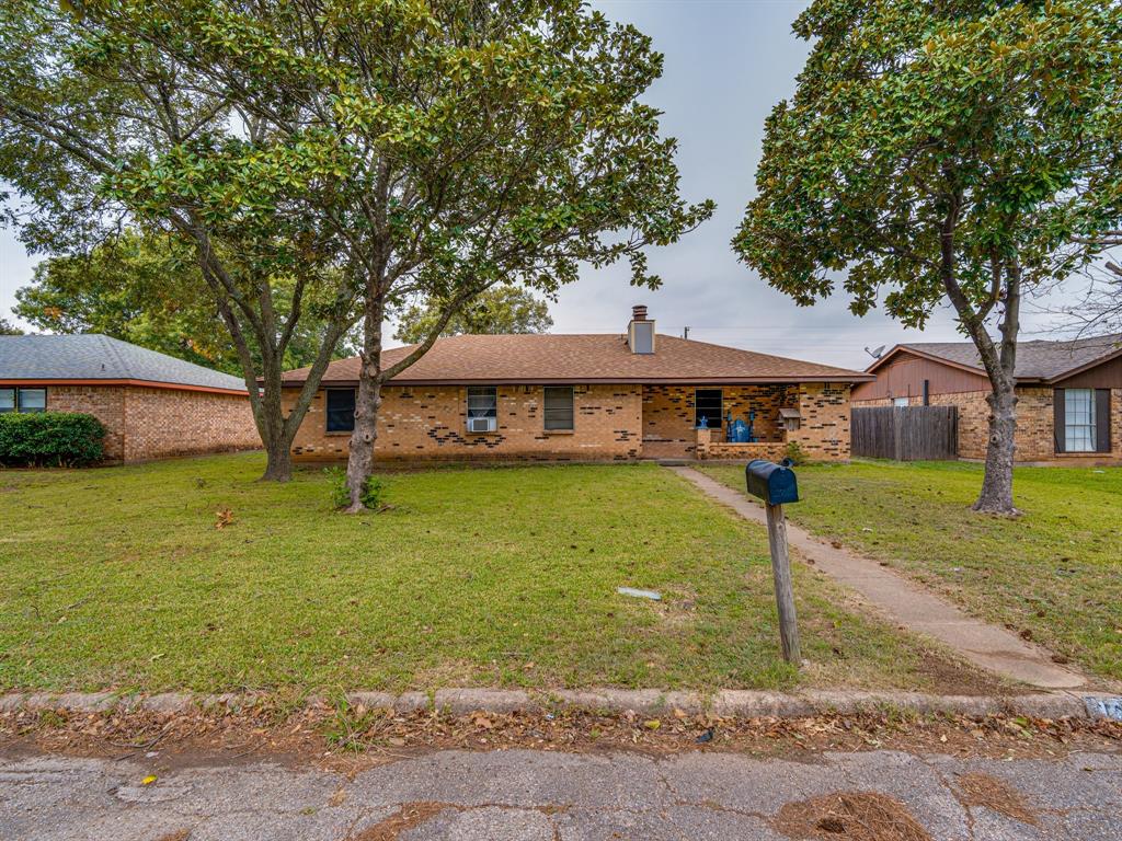 1605 Spring Branch Drive Cleburne, TX 76033 - Photo 1 of 1 a front view of a house with garden