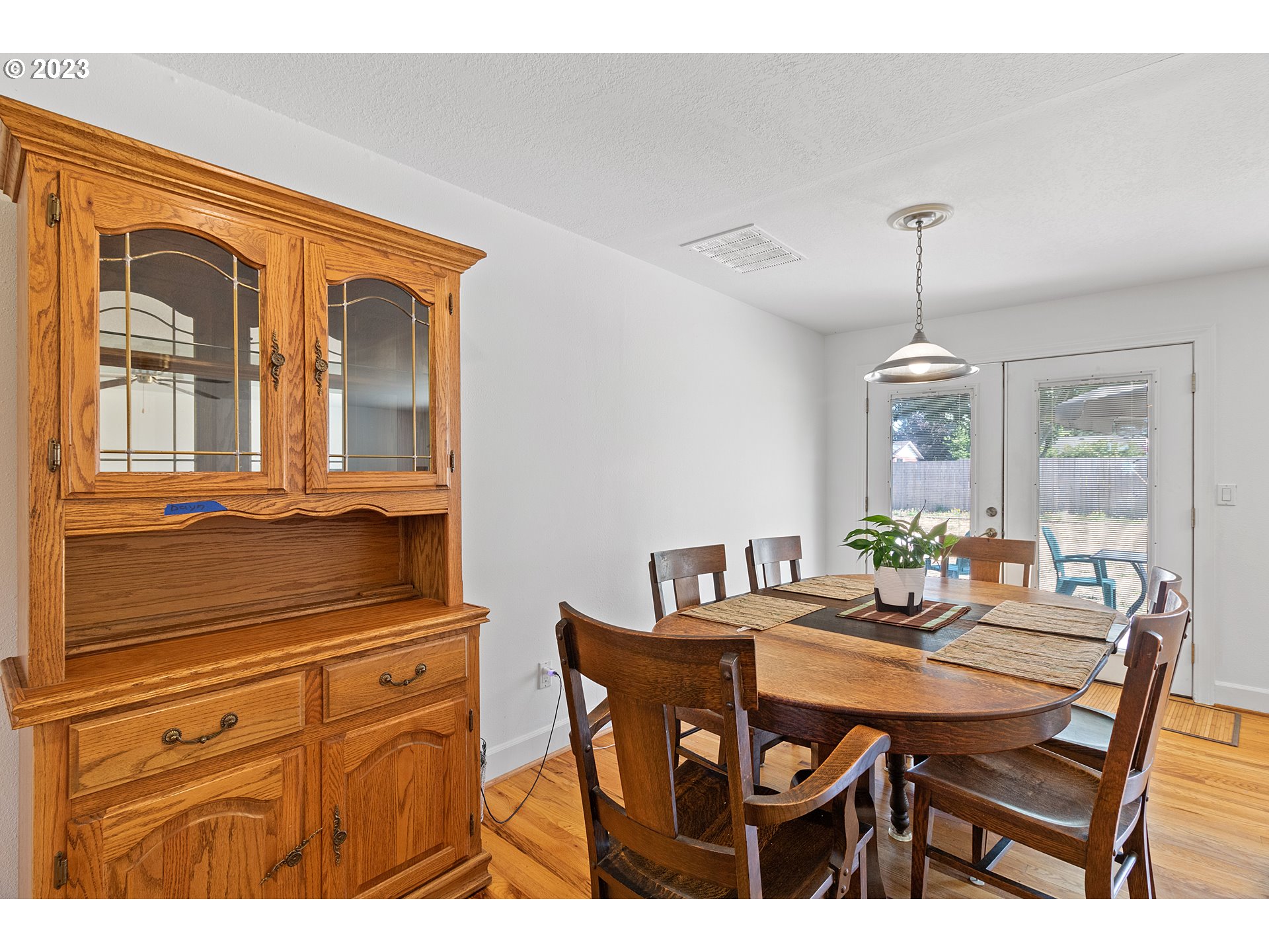 19600 Leland Road Oregon City, OR 97045 - Photo 11 of 34 a dining room with furniture a chandelier and window