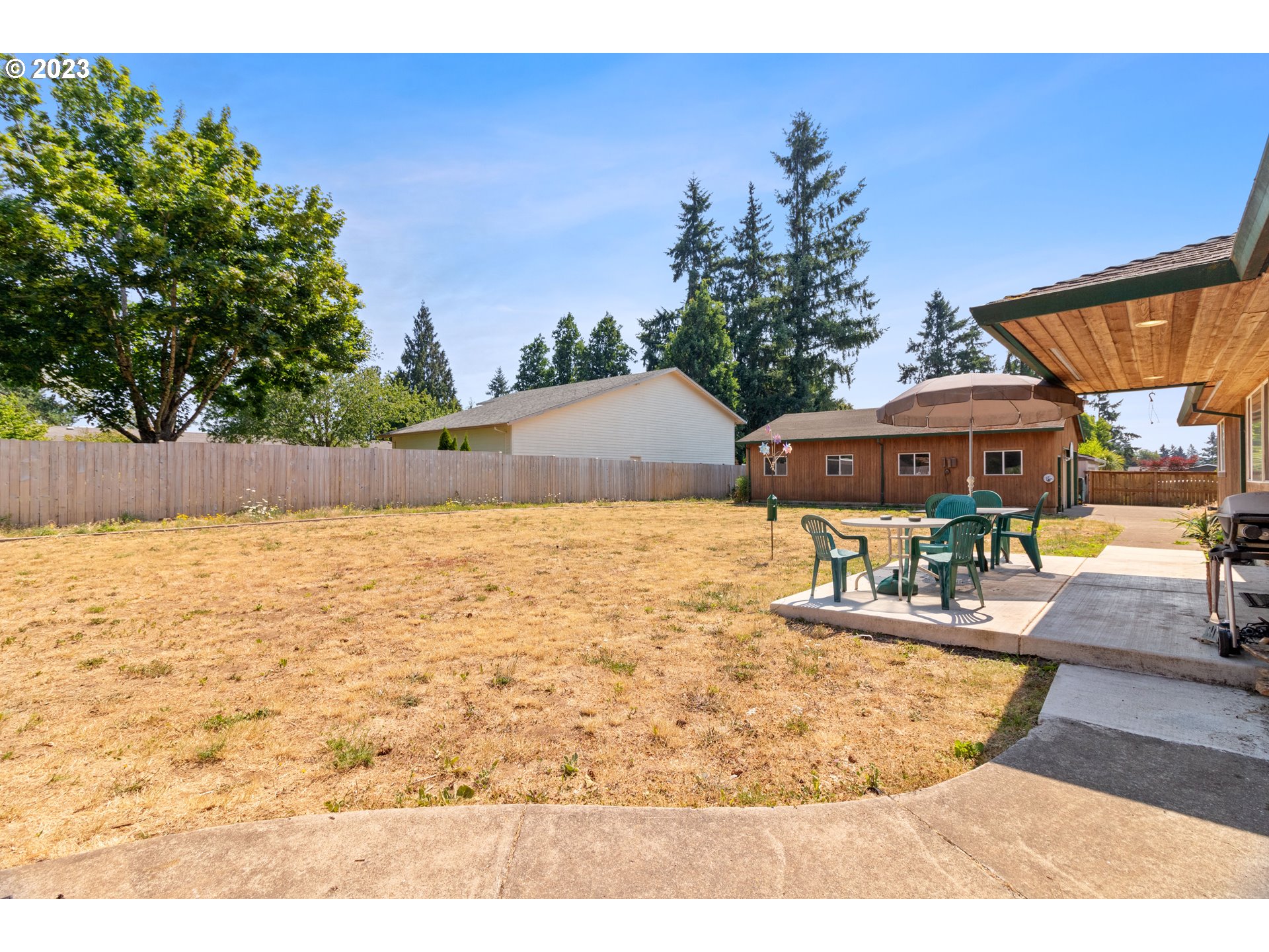 19600 Leland Road Oregon City, OR 97045 - Photo 33 of 34 a swimming pool with outdoor seating and yard