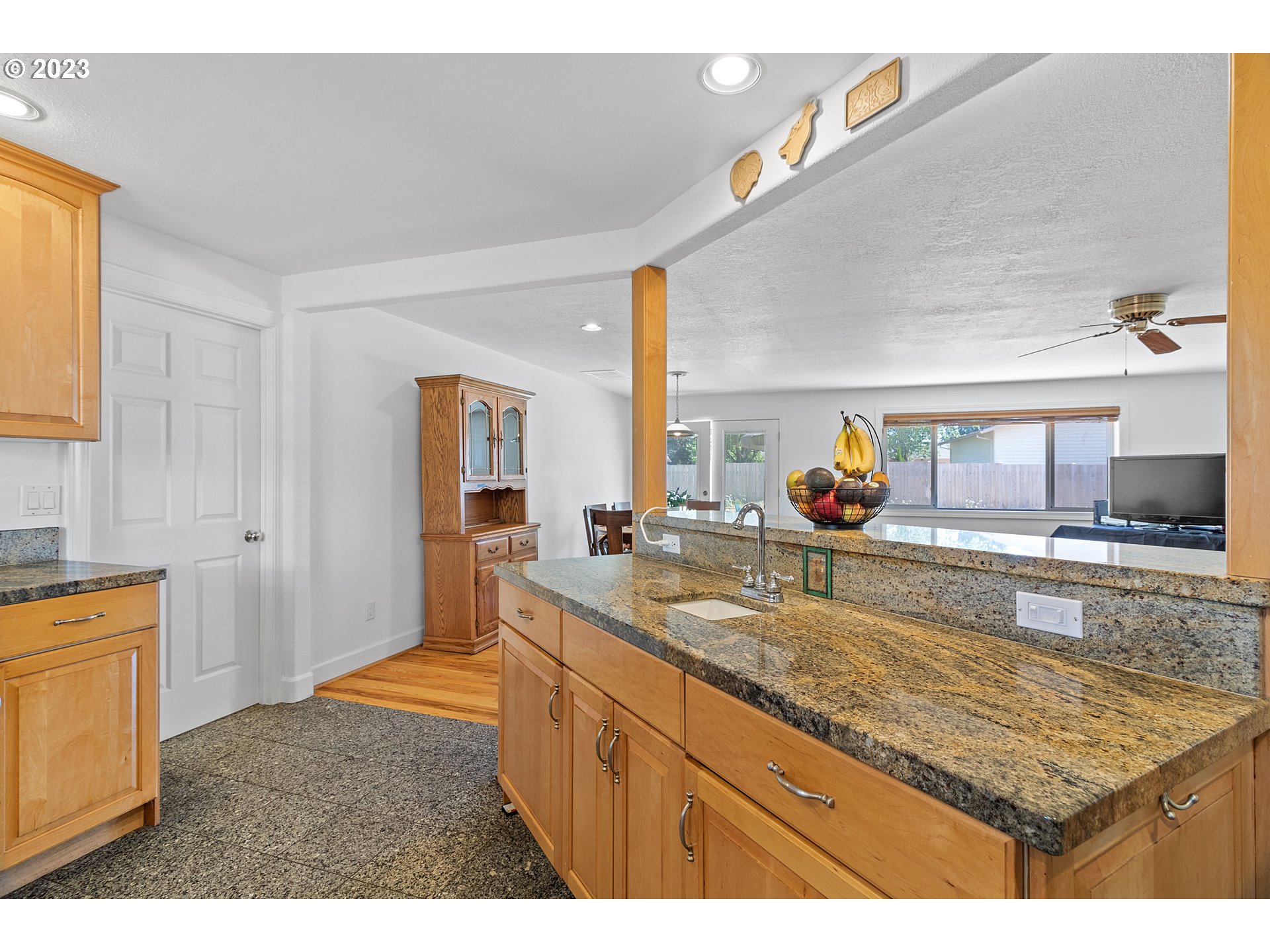 19600 Leland Road Oregon City, OR 97045 - Photo 5 of 34 a kitchen with granite countertop a sink and a stove