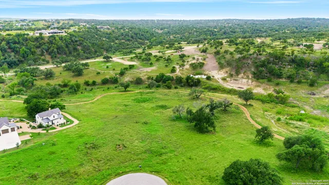 a backyard of a house with a yard and lake view
