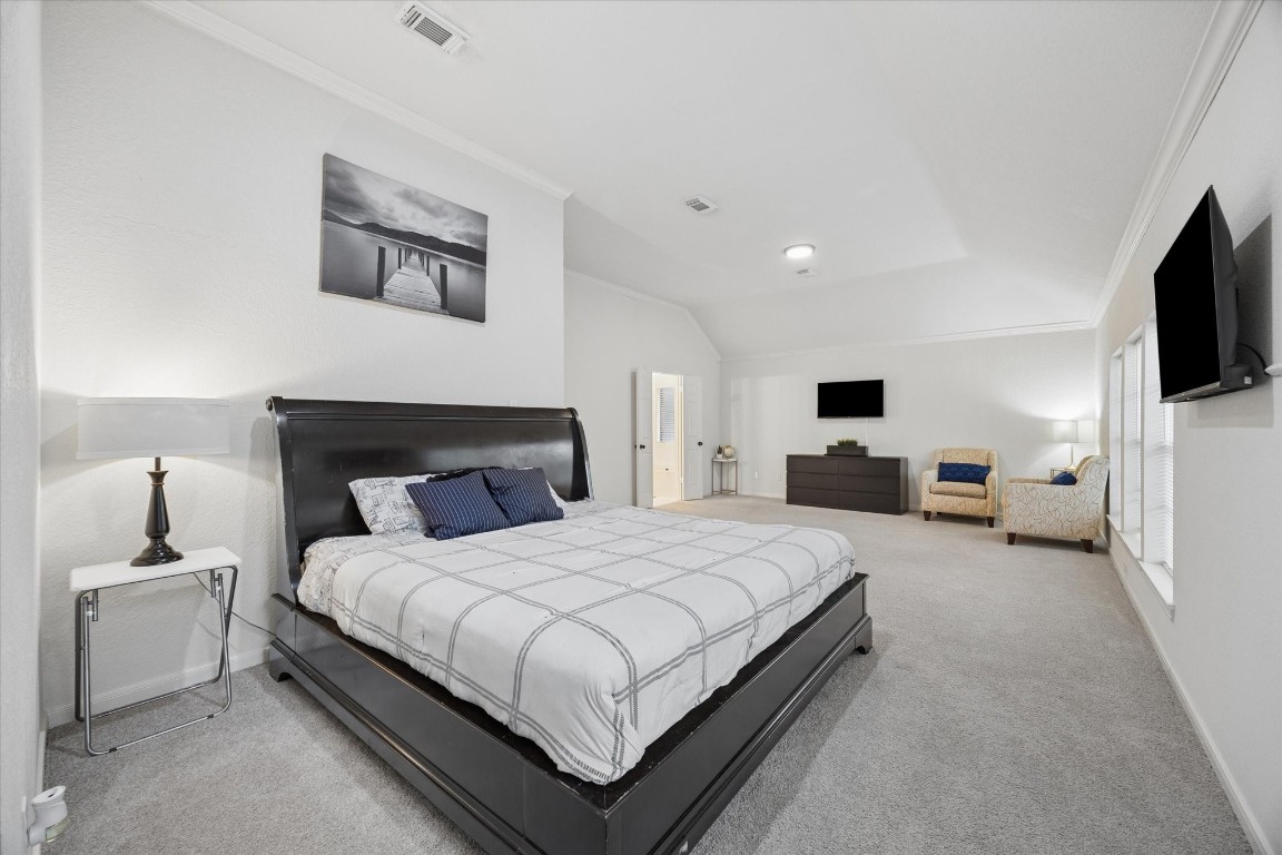 4419 3 Rivers Drive Sugar Land, TX 77478 - Photo 17 of 33 a bedroom with a bed and a flat screen tv