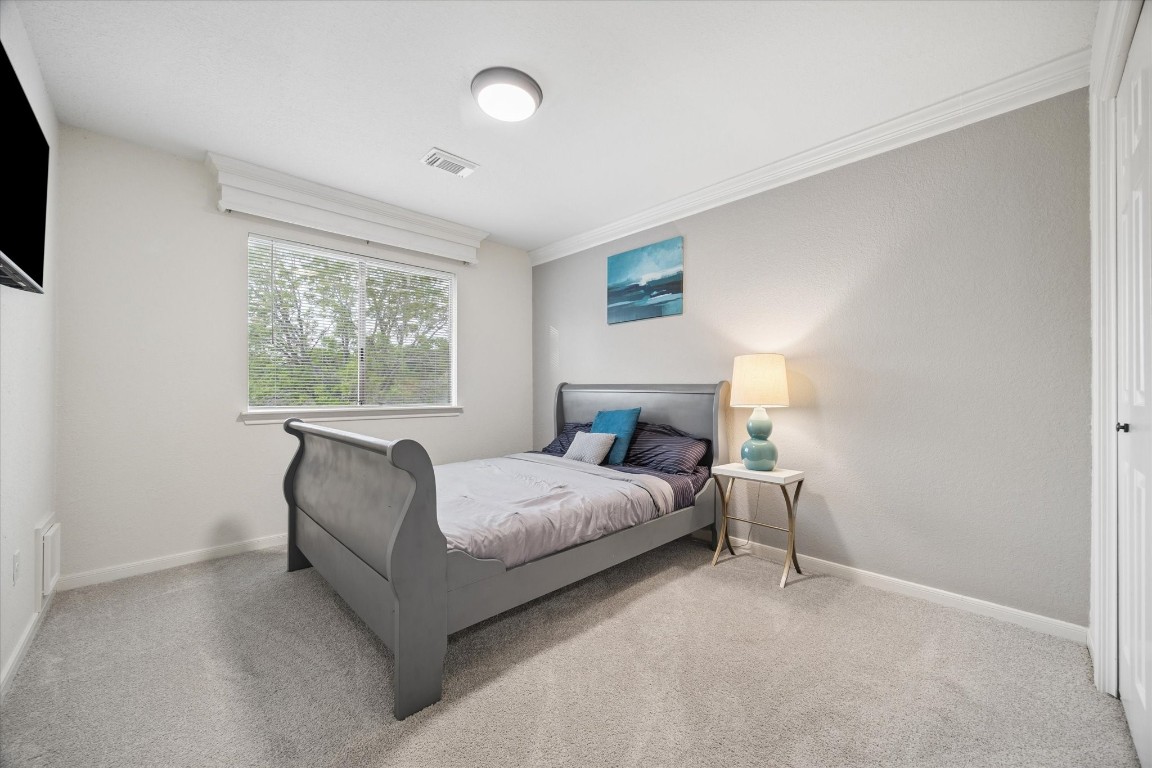 4419 3 Rivers Drive Sugar Land, TX 77478 - Photo 20 of 33 a bedroom with a bed and a window