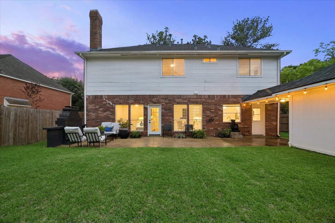 4419 3 Rivers Drive Sugar Land, TX 77478 - Photo 27 of 33 a view of a house with a yard and sitting area
