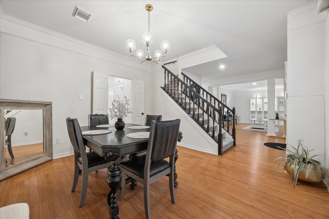 4419 3 Rivers Drive Sugar Land, TX 77478 - Photo 9 of 33 a view of a dining room with furniture wooden floor and chandelier