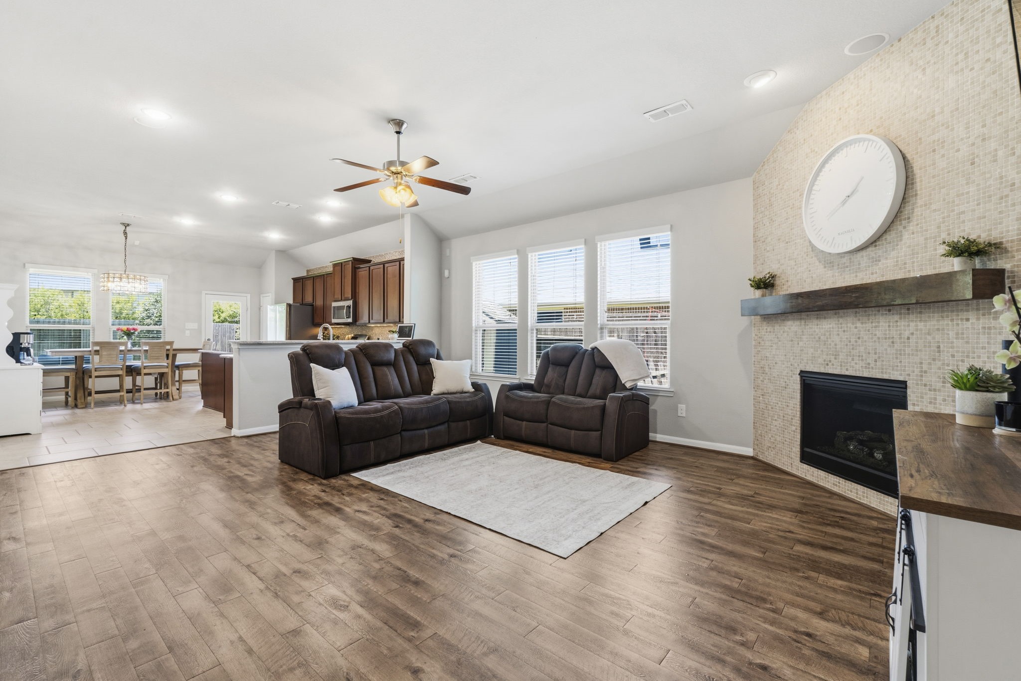 3900 Enchanted Timbers Lane Spring, TX 77386 - Photo 13 of 49 a living room with furniture kitchen view and a fireplace