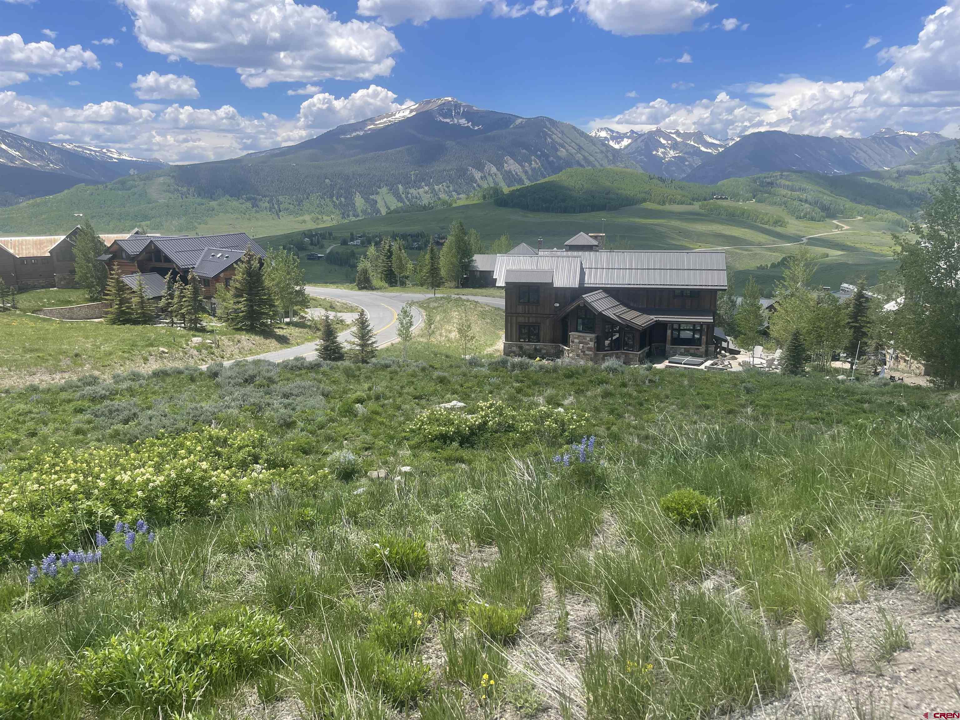 57 Summit Road Crested Butte, CO 81225 - Photo 5 of 22 a view of a lake with a mountain in the background