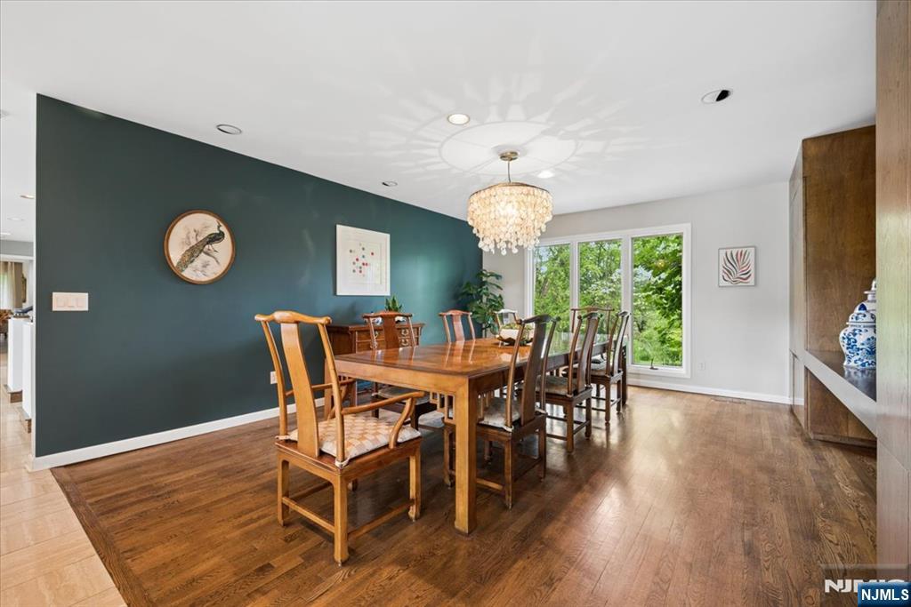 39 Eagle Nest Road Morris Township, NJ 07960 - Photo 15 of 43 a view of a dining room with furniture window and wooden floor