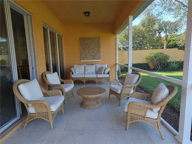 a patio with patio a couch and chairs