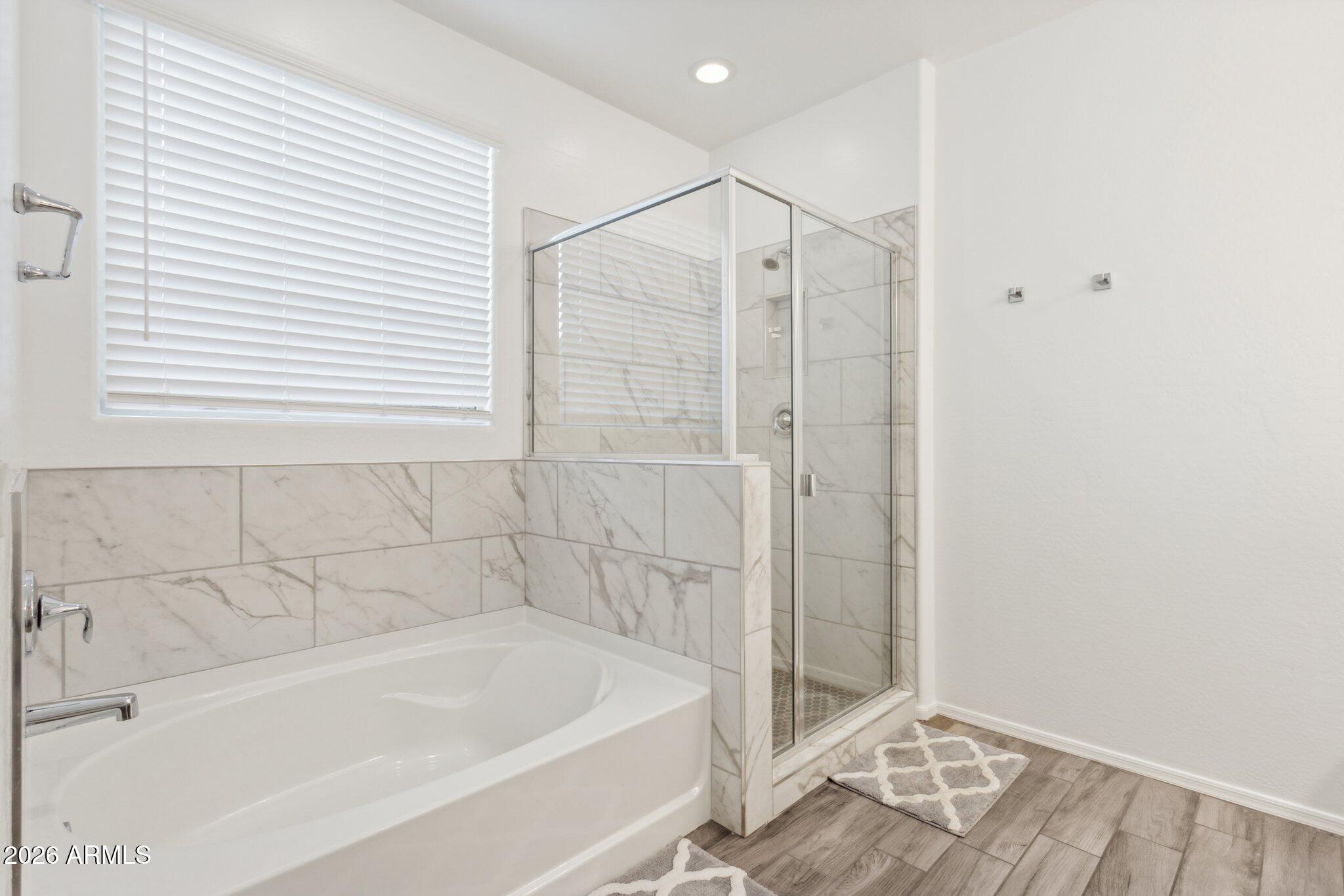 17334 West Wandering Creek Road Goodyear, AZ 85338 - Photo 20 of 67 Fully Tiled Shower and Soaking Tub