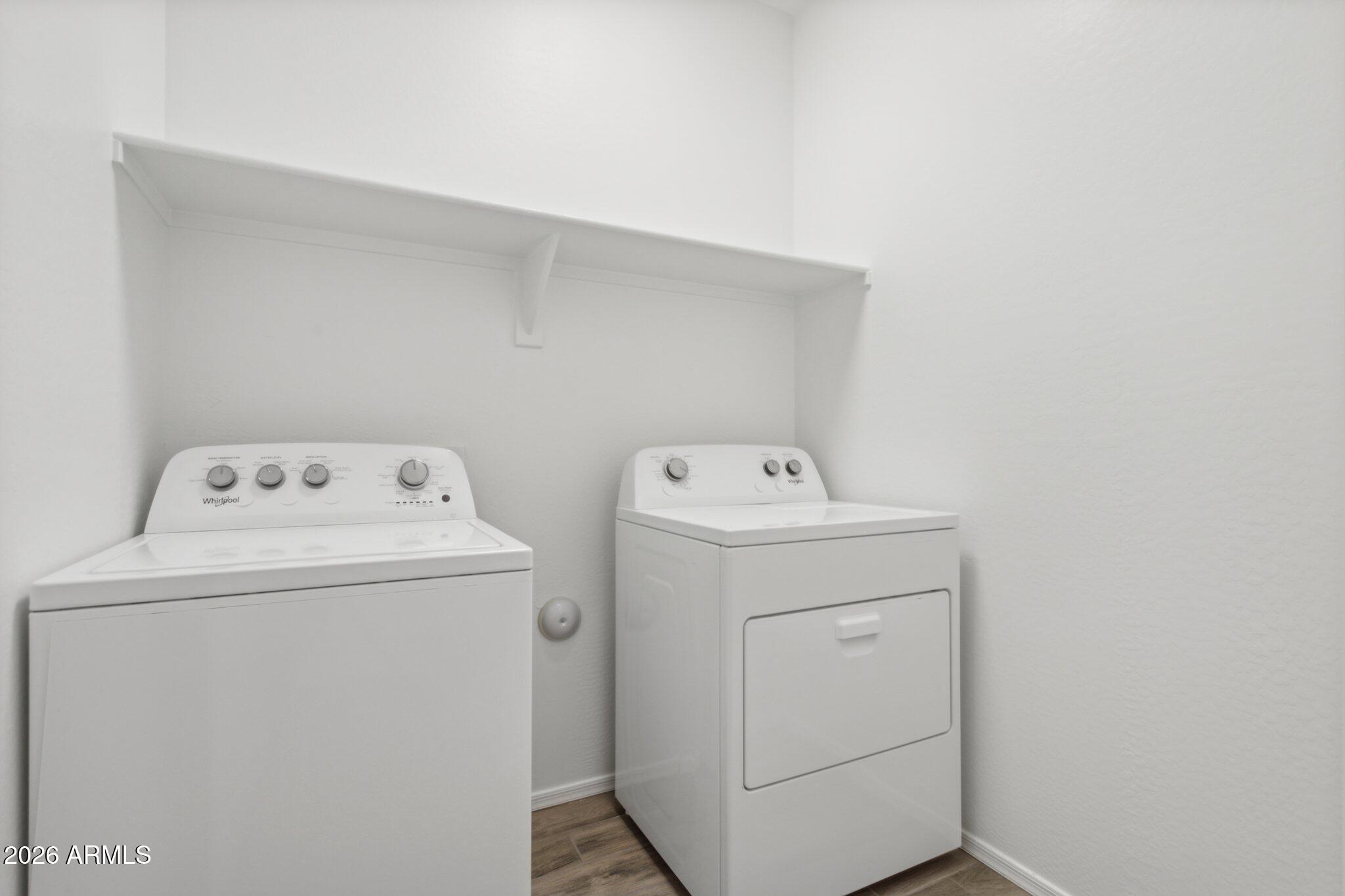 17334 West Wandering Creek Road Goodyear, AZ 85338 - Photo 27 of 67 a utility room with dryer and washer