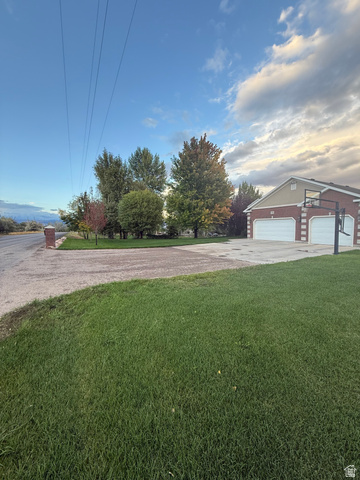 3145 South 500 West Vernal, UT 84078 - Photo 6 of 64 View of green lawn with driveway