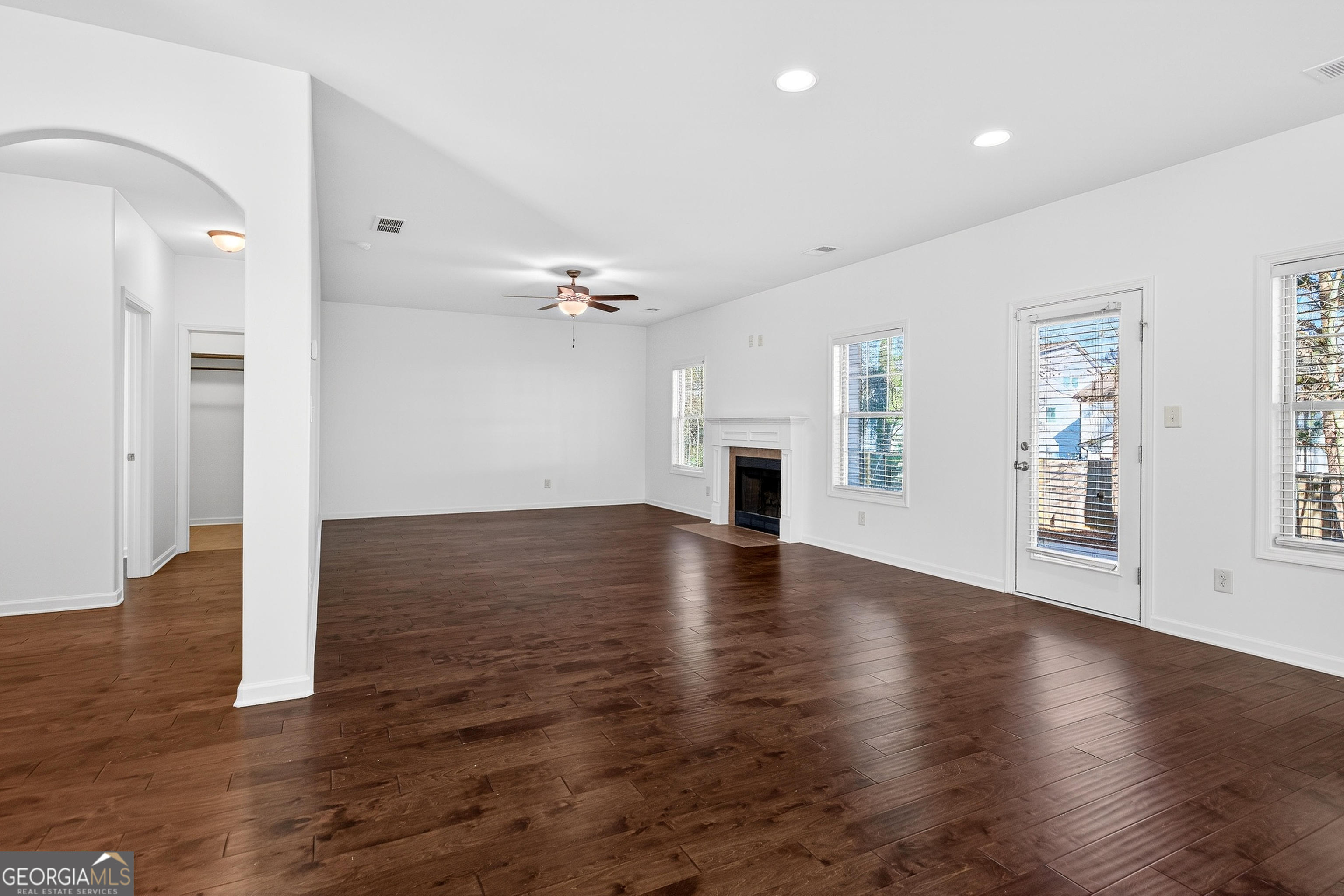 167 Cliffhaven Circle Newnan, GA 30263 - Photo 18 of 47 a view of empty room with wooden floor and fireplace