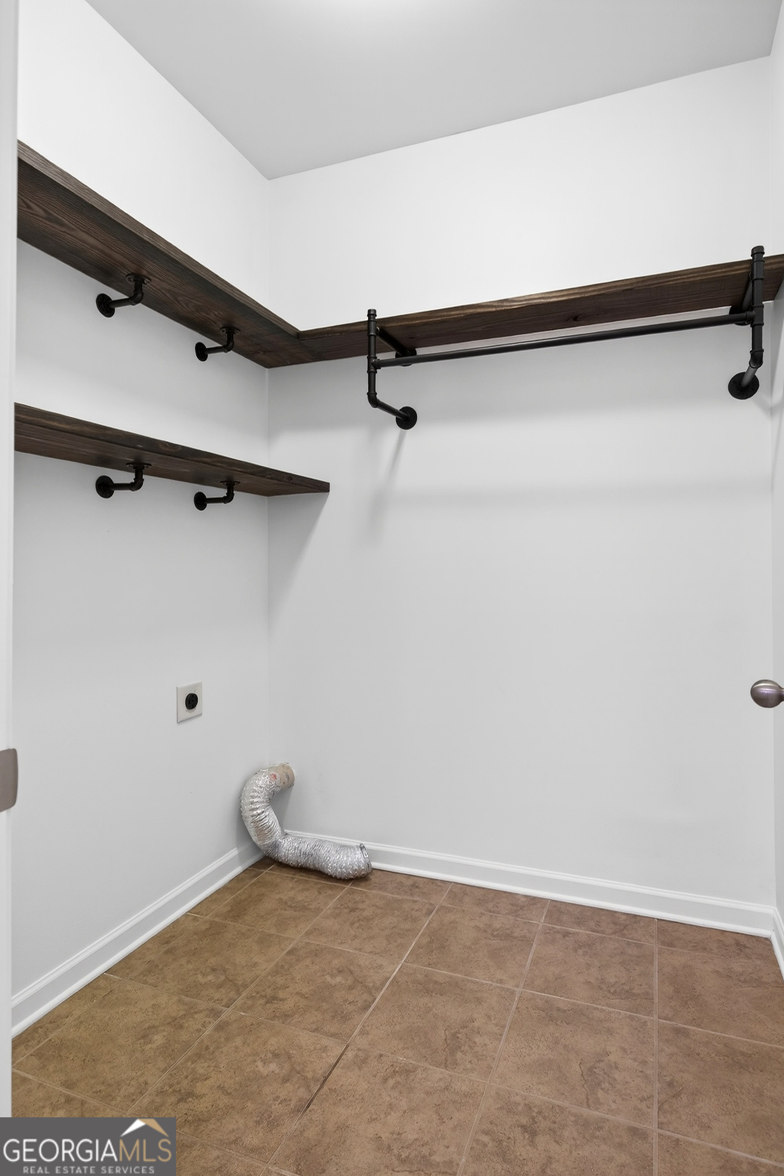 167 Cliffhaven Circle Newnan, GA 30263 - Photo 23 of 47 a view of a room with racks on the wall