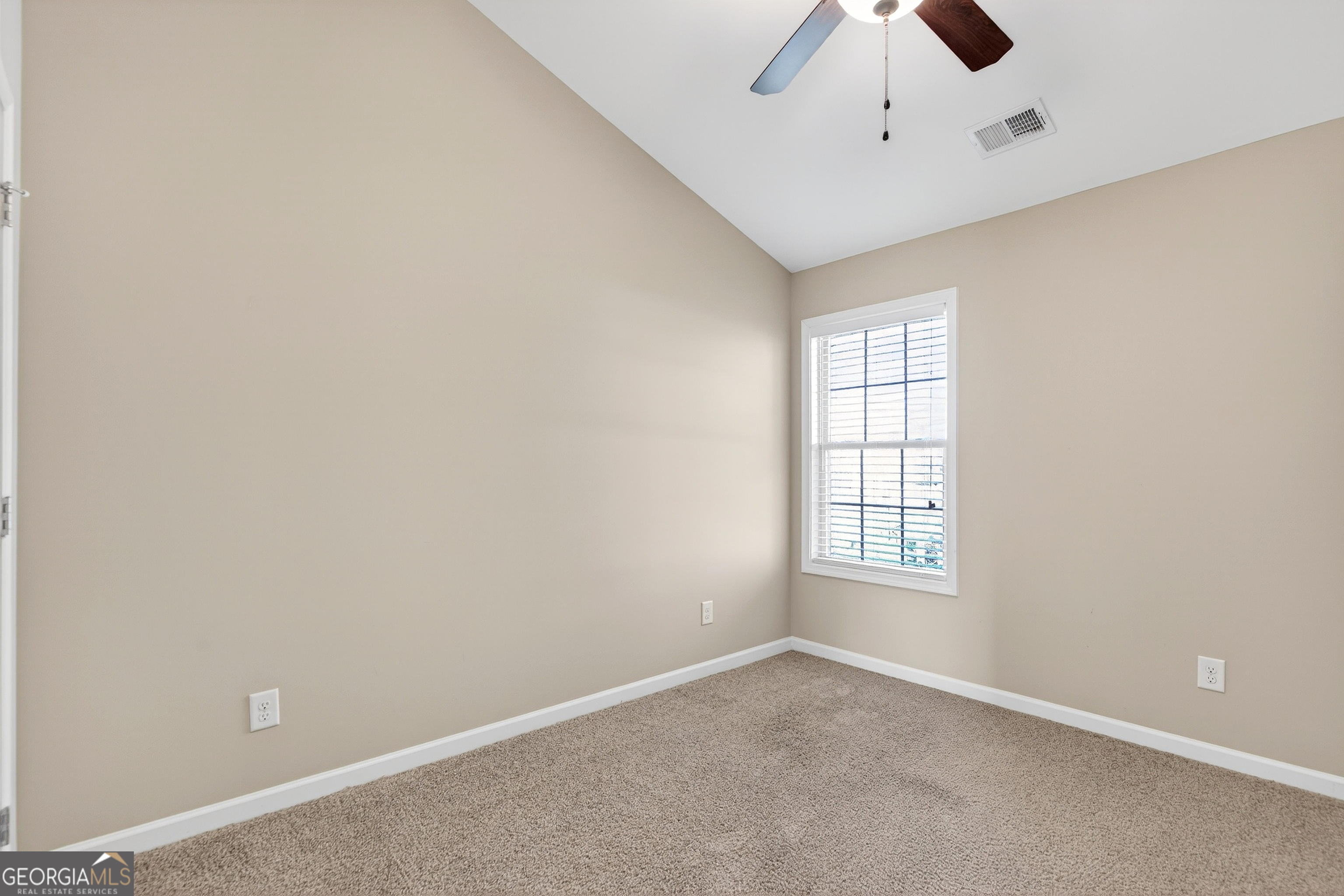167 Cliffhaven Circle Newnan, GA 30263 - Photo 36 of 47 an empty room with a window and a fan