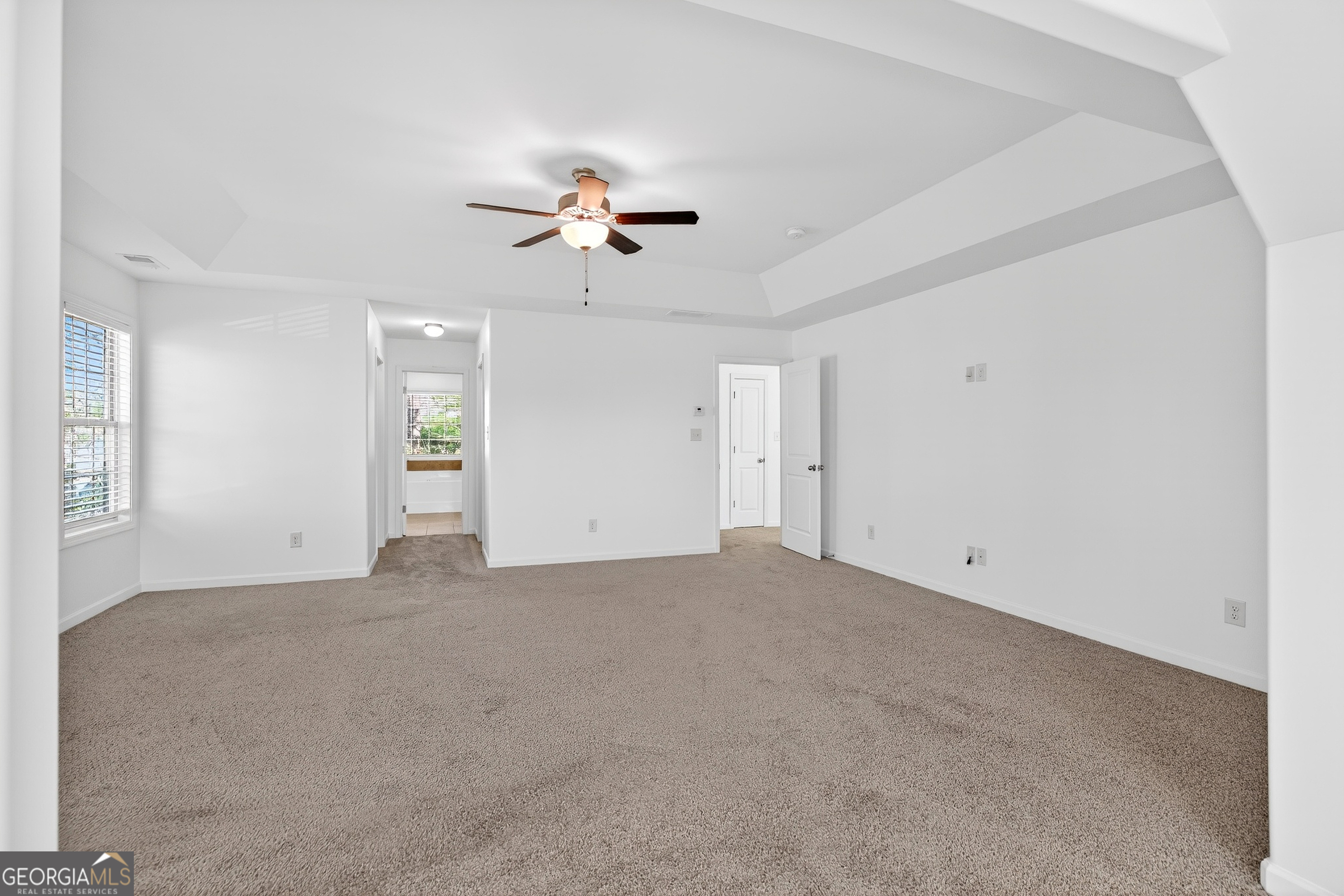167 Cliffhaven Circle Newnan, GA 30263 - Photo 4 of 47 a view of a big room with chandelier fan and windows