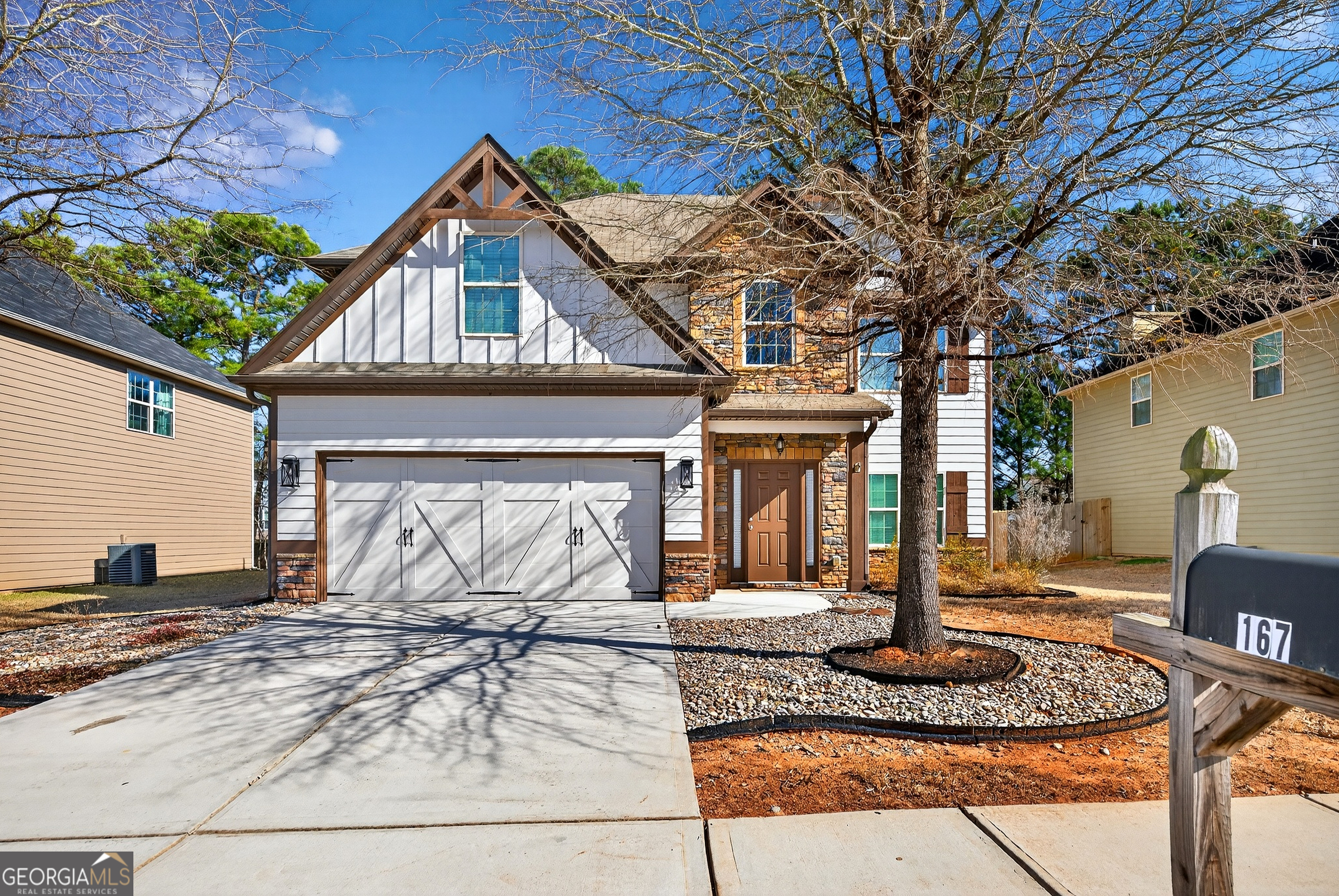 167 Cliffhaven Circle Newnan, GA 30263 - Photo 9 of 47 a front view of a house with garden