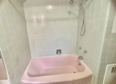 a bathroom with a white bath tub