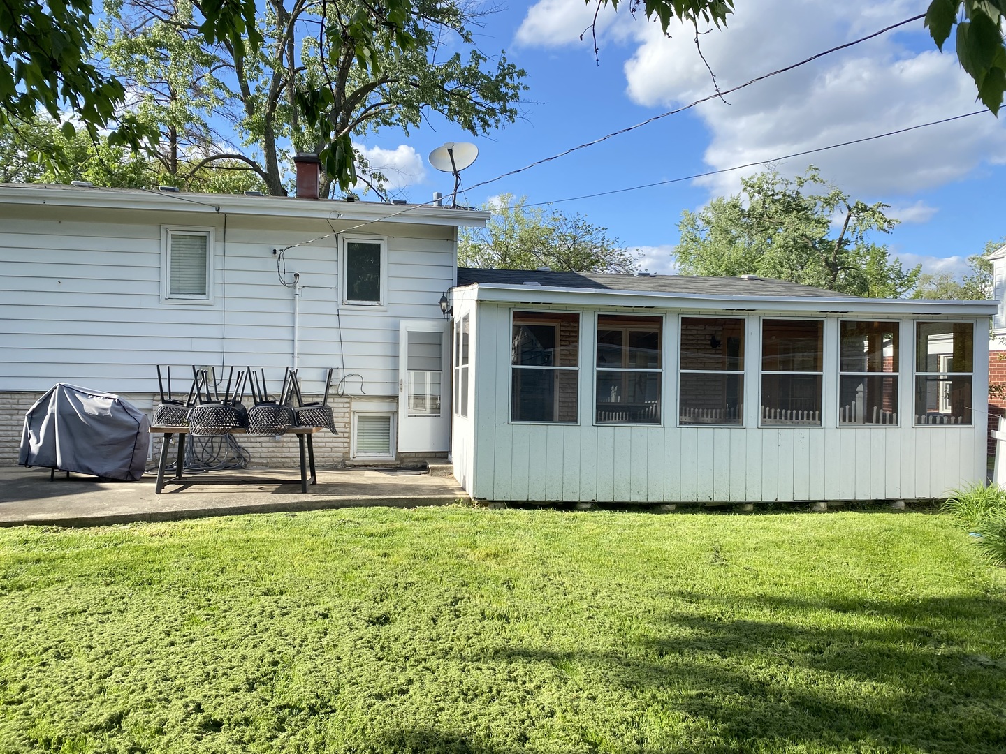 2341 Clyde Terrace Homewood, IL 60430 - Photo 8 of 13 a front view of a house with a yard