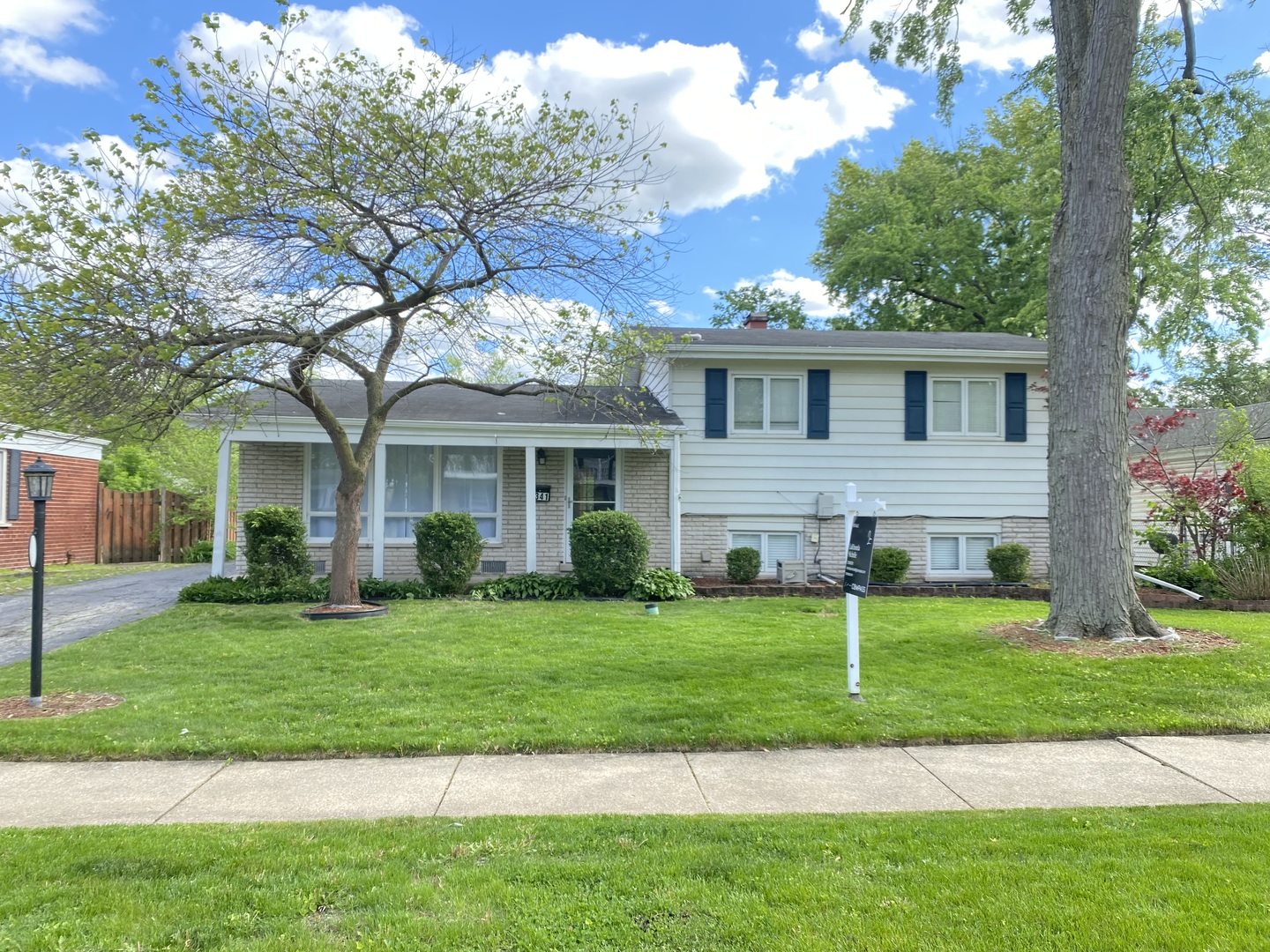 2341 Clyde Terrace Homewood, IL 60430 - Photo 2 of 13 a front view of a house with a yard and trees