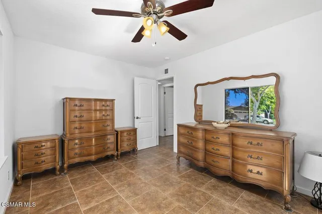 a room with a cabinets and a dresser