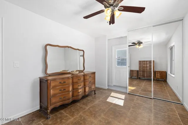 a view of a livingroom with furniture and windows
