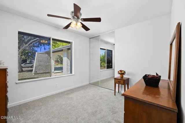 a room with a dresser and a mirror