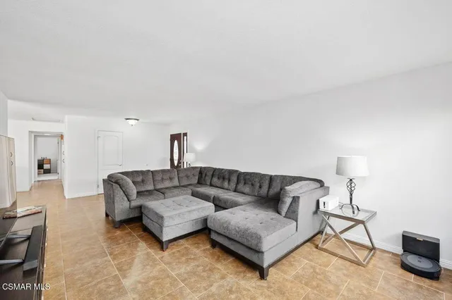 a living room with furniture and a couch