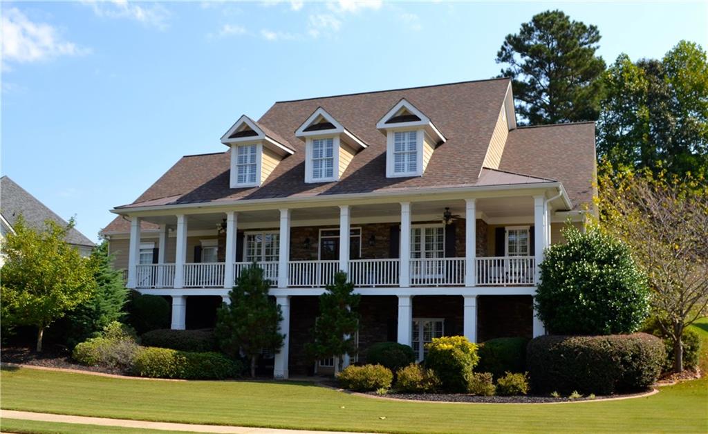 4124 Gold Mill Ridge Canton, GA 30114 - Photo 1 of 1 THIS HOME HAS IT ALL....Wrap around southern porch and professional landscaping