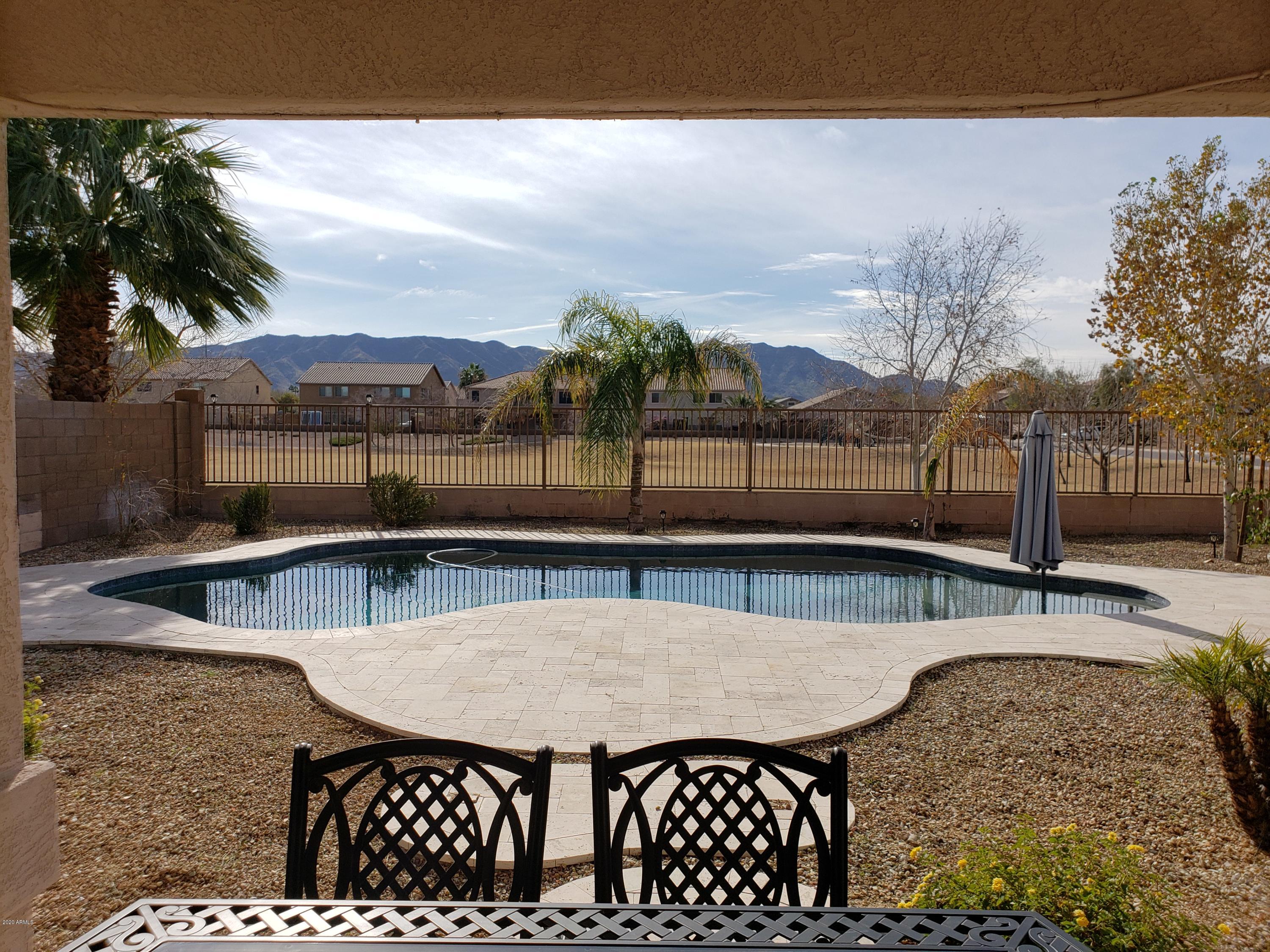 2917 West Fremont Rd. Phoenix, AZ 85041 - Photo 32 of 41 a view of a swimming pool with a patio