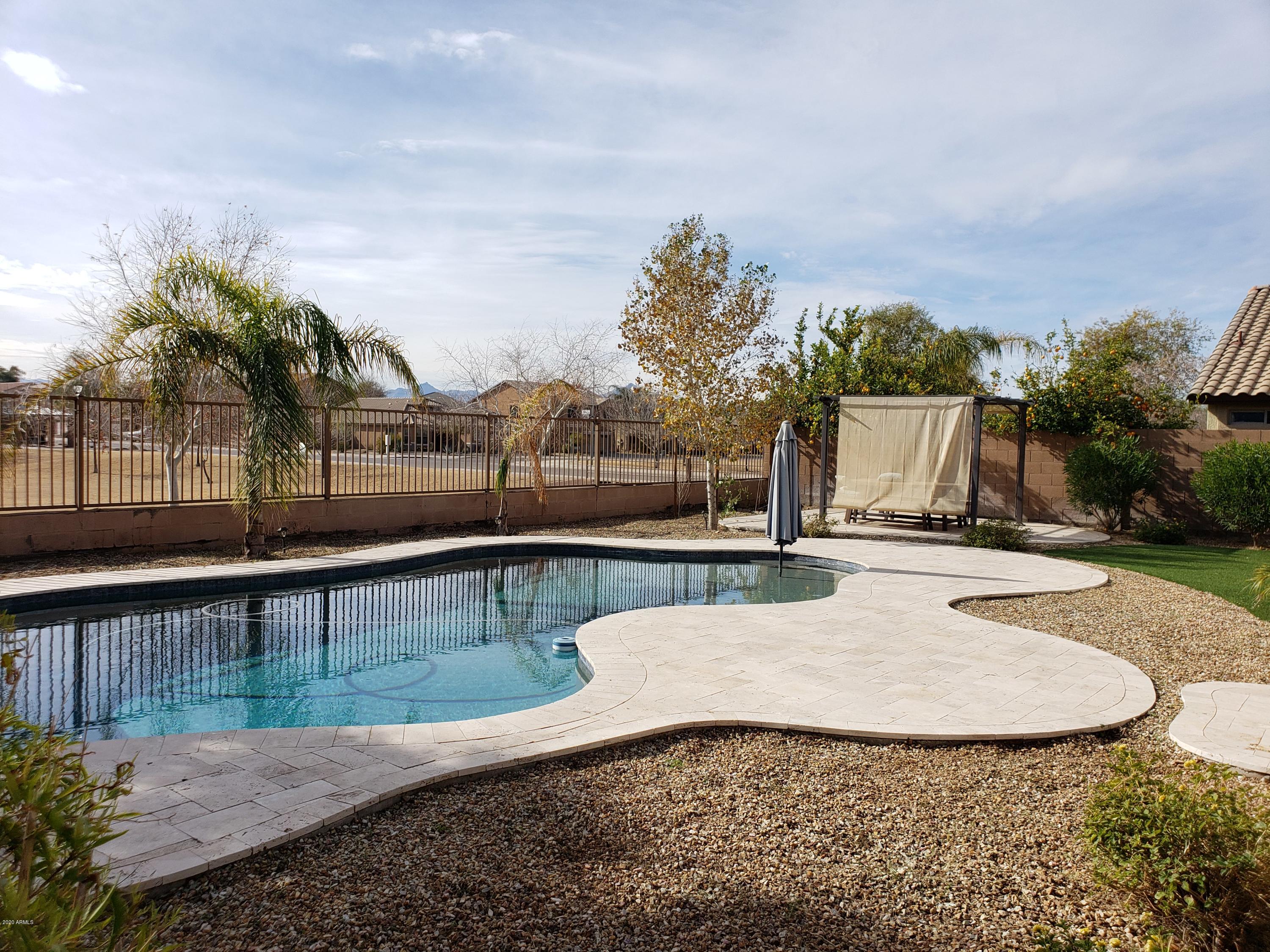 2917 West Fremont Rd. Phoenix, AZ 85041 - Photo 36 of 41 a view of a swimming pool with a lounge chair
